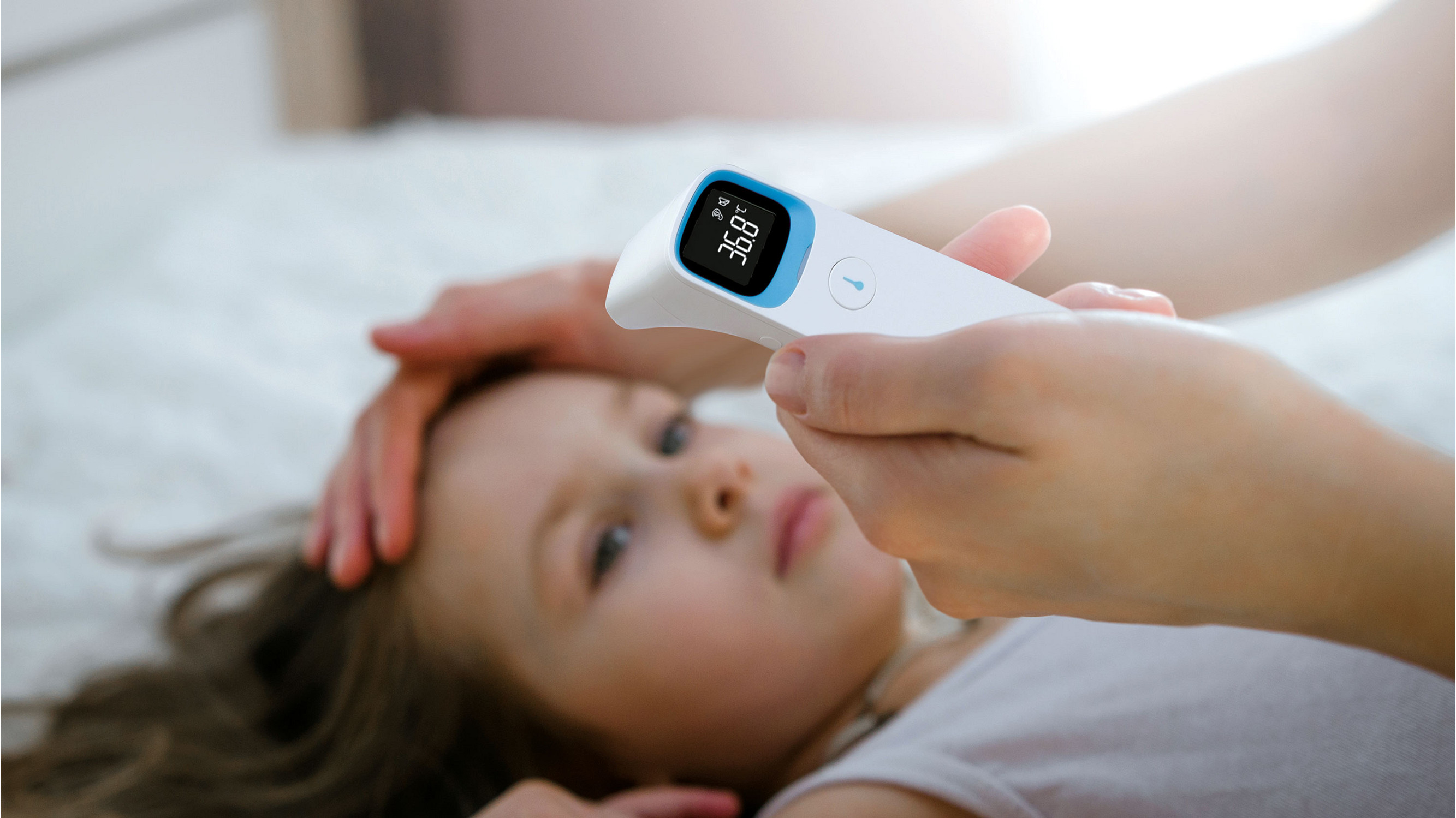 Using Thermometer on Child
