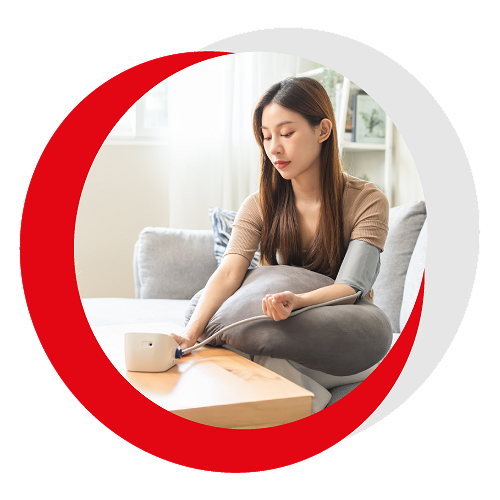 Image of woamn checking her blood pressure